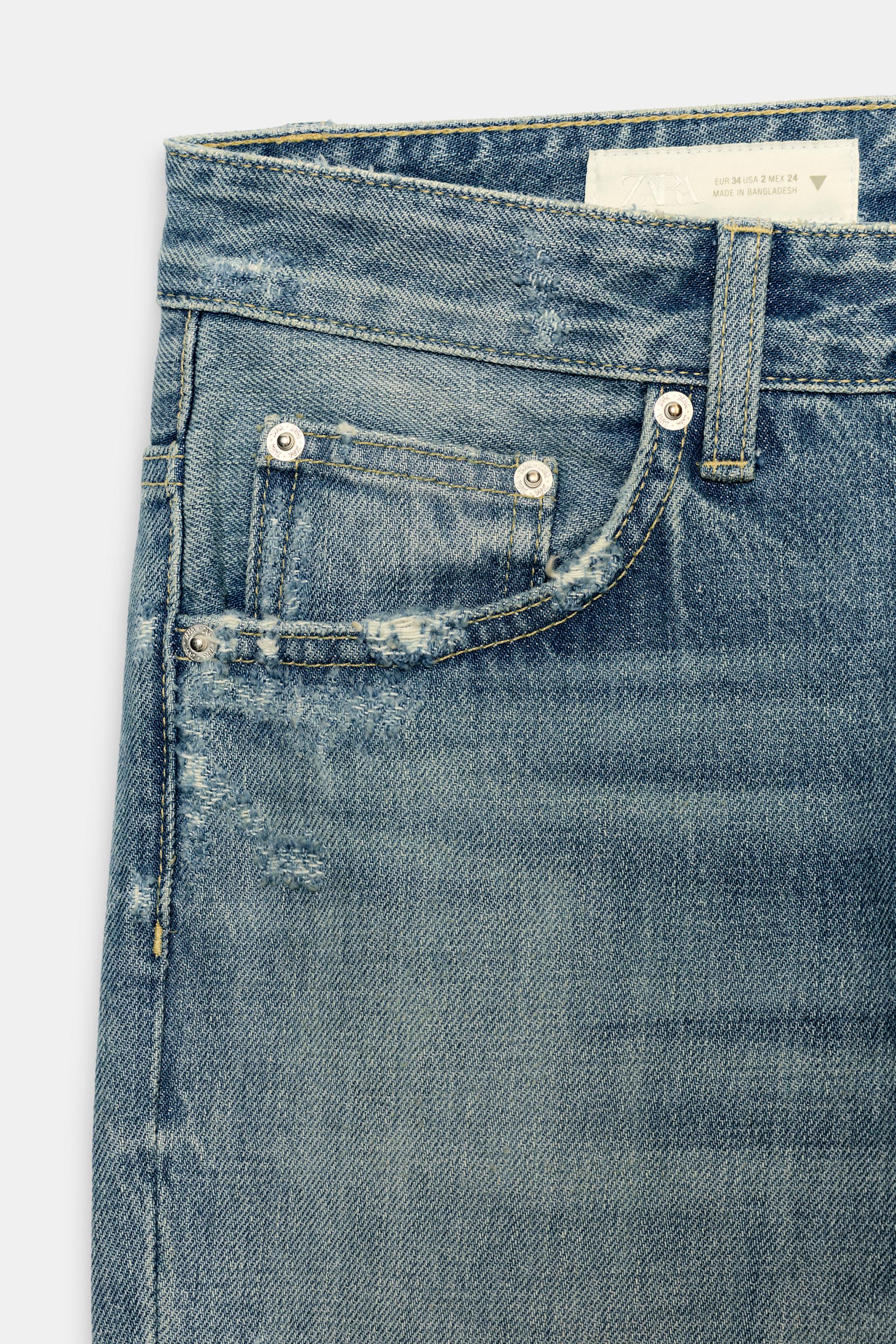 TRF FLARE RIPPED MID-RISE JEANS
